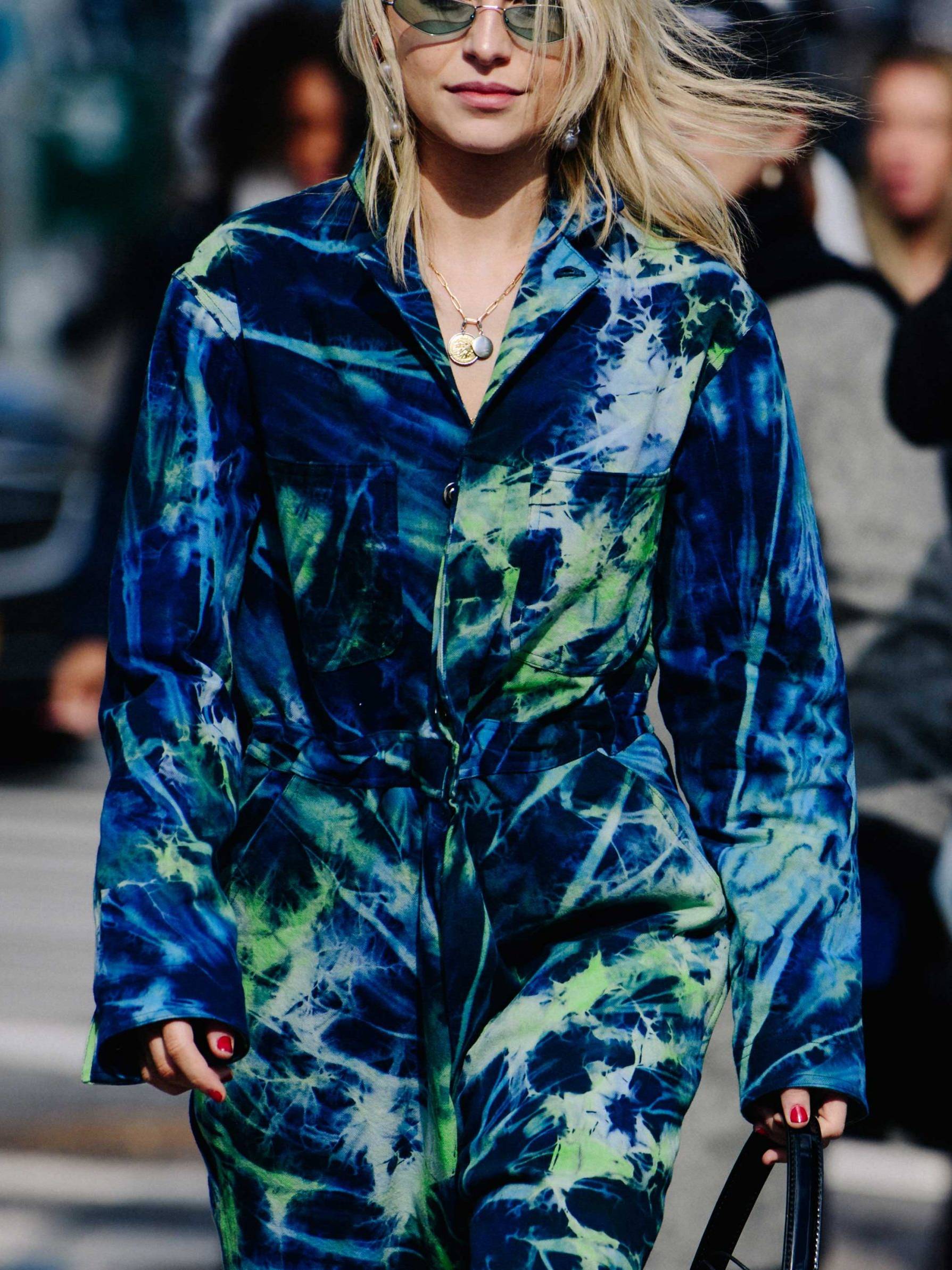 Woman wearing a tie dye boiler suit