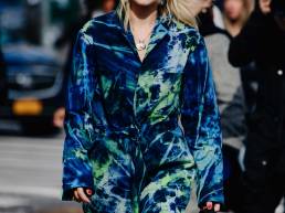 Woman wearing a tie dye boiler suit